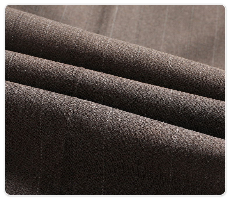 Macro shot of gray pinstripe suit fabric showing textile weave and subtle stripe pattern