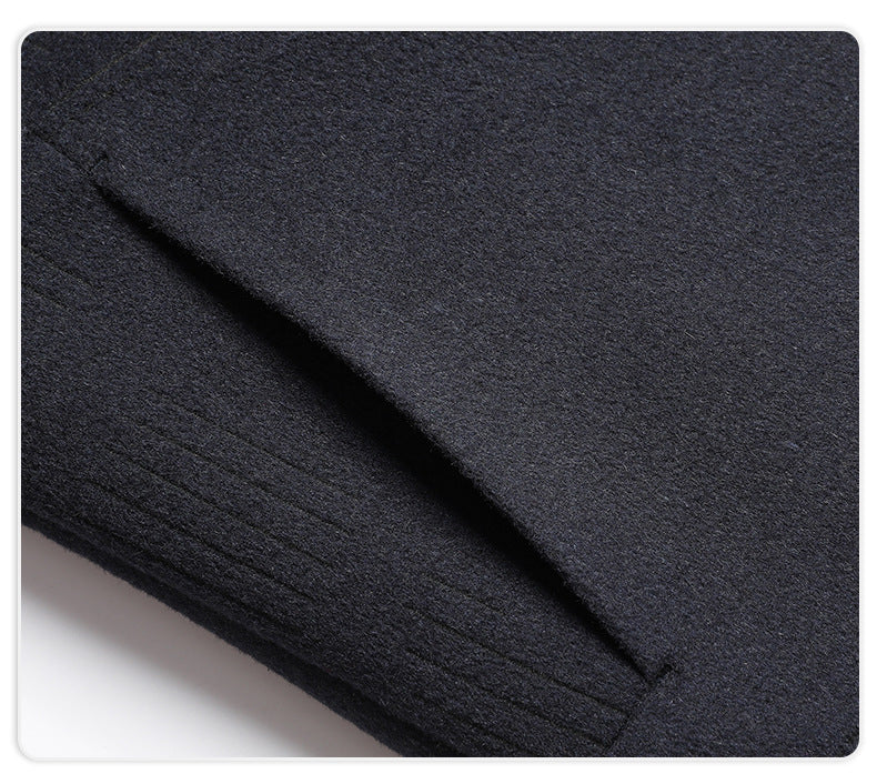 Detail shot of navy wool jacket fabric showing texture and fold