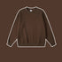 Dark brown crewneck sweatshirt with ribbed trim displayed against brown background