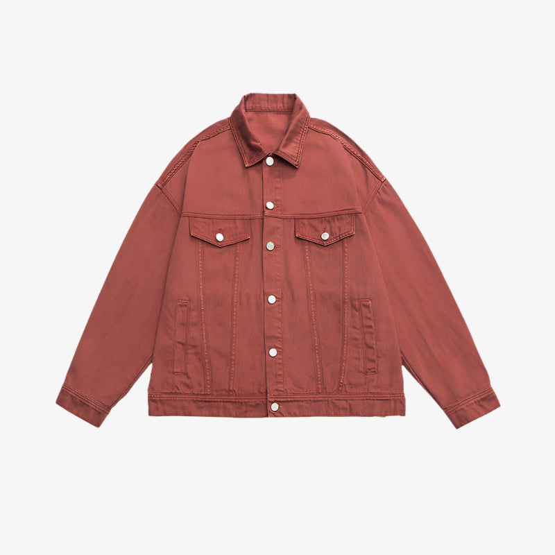 Rust red denim jacket with silver buttons and chest pockets displayed flat against white background