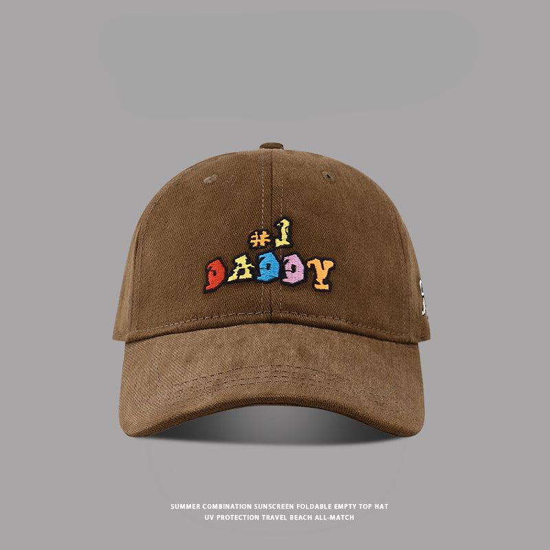 Brown '#1 Daddy' baseball cap with colorful embroidery, curved brim, and adjustable strap for a casual fit