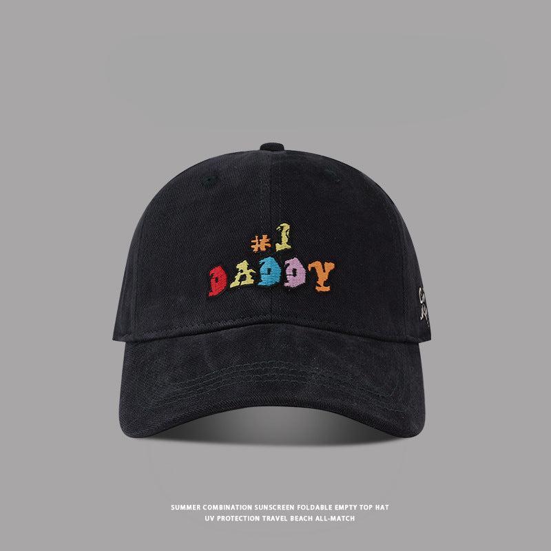 Black '#1 Daddy' embroidered baseball cap with colorful text, vintage washed cotton, and a classic curved brim