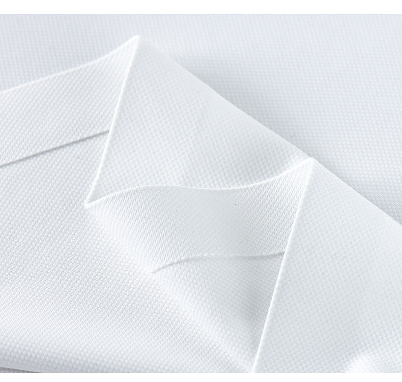 Detail of white polo shirt collar construction showing stitching and fabric texture