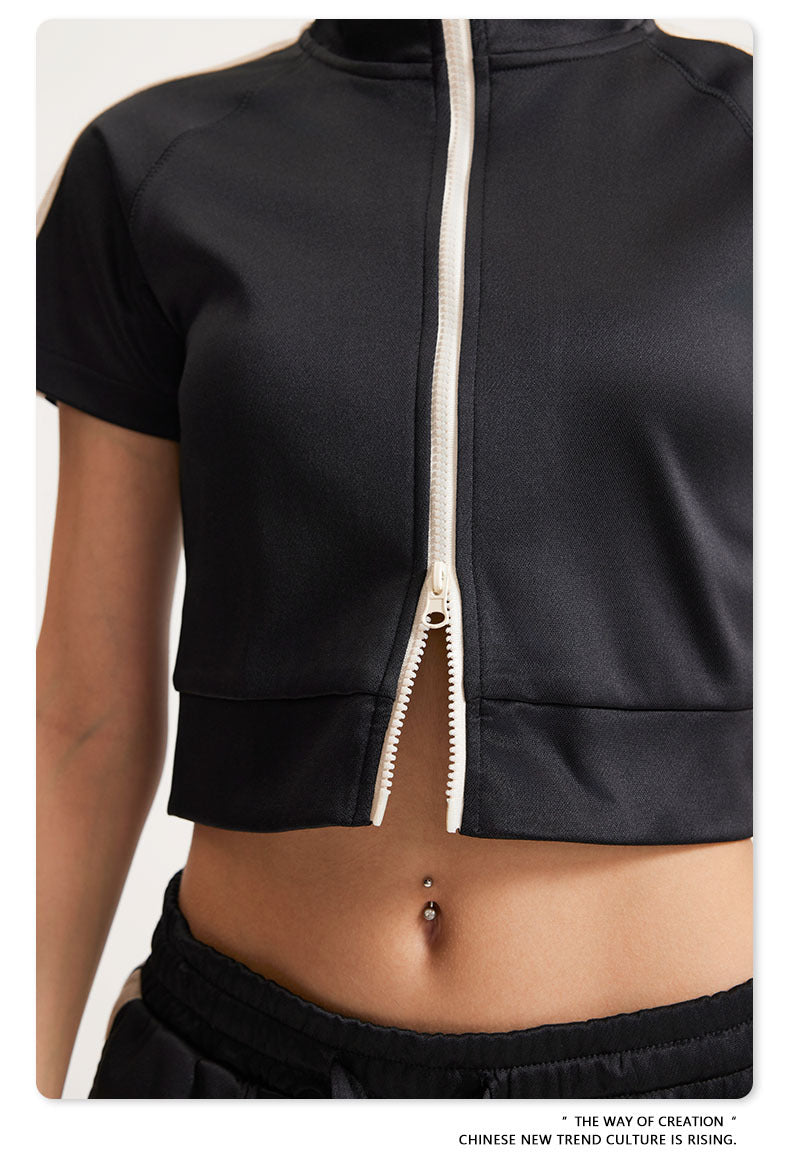 Black crop top with white zip front detail