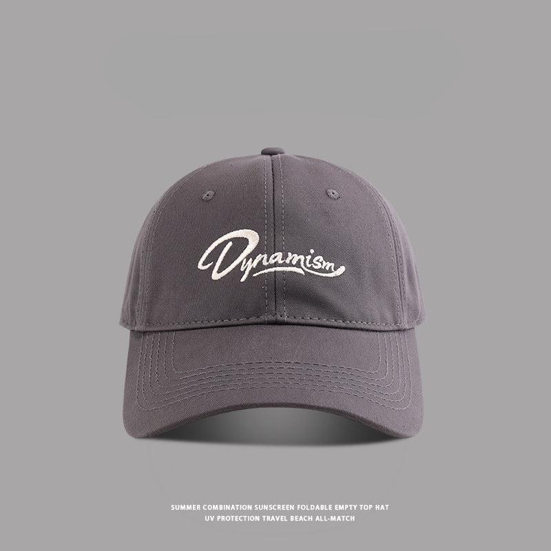 Gray baseball cap with white Dynamism script embroidery