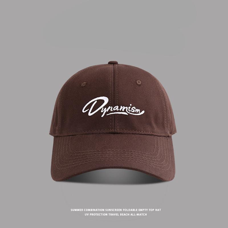 Coffee brown baseball cap with white Dynamism script embroidery