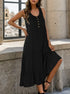 Black flowy midi dress with gold buttons, model posing by window with city view, wearing black ankle-strap heels