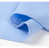 Close-up of light blue dress shirt fabric showing fine twill weave texture and smooth finish against white background