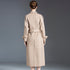 Back view of a beige wool trench coat with a belt and button details