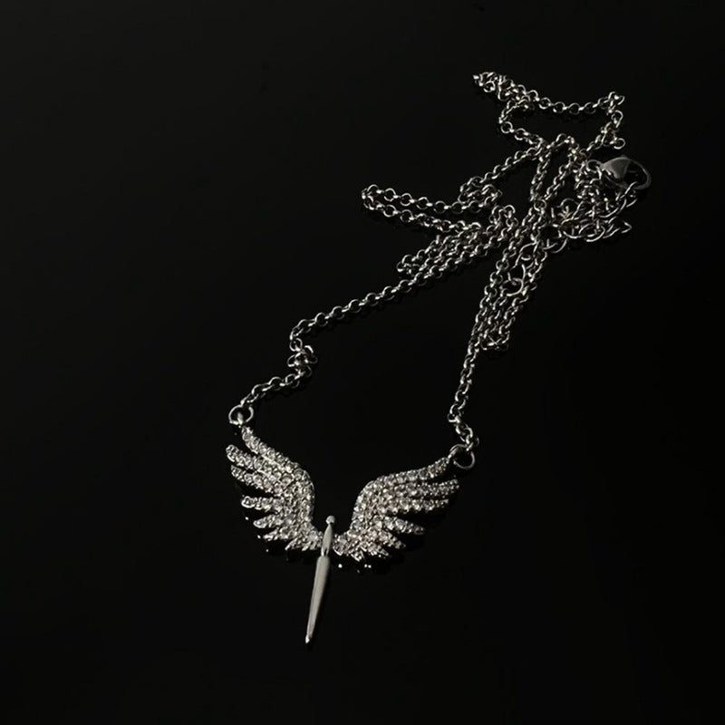 Silver necklace with crystal-encrusted angel wing cross pendant