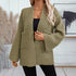 Front view of relaxed-fit green knit cardigan showing detailed herringbone stitch pattern and patch pockets