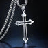 Silver stainless steel cross pendant with black inlay, displayed against a dark background
