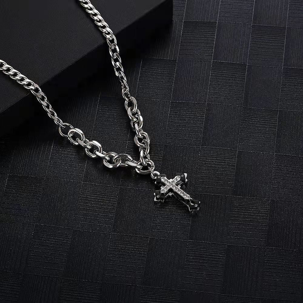 Silver chain necklace with rhinestone-studded cross pendant