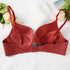 Back view of terracotta red push-up bra showing hook closure and straps with floral decor