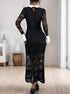 A woman showcasing the back of a black lace dress with a keyhole closure, white collar, and flared cuffs, styled with black heels.