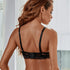 Back view of black lace bra featuring adjustable straps and multi-hook closure with lace trim detail