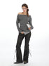 Off-shoulder striped top styled with black leather flared pants with side lace-up detail 