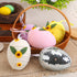 A basket filled with soft fabric Easter eggs in pastel colors, featuring sunflower accents, each egg measuring 13cm x 10cm.