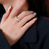 Gold and white bamboo joint ring worn with neutral nails