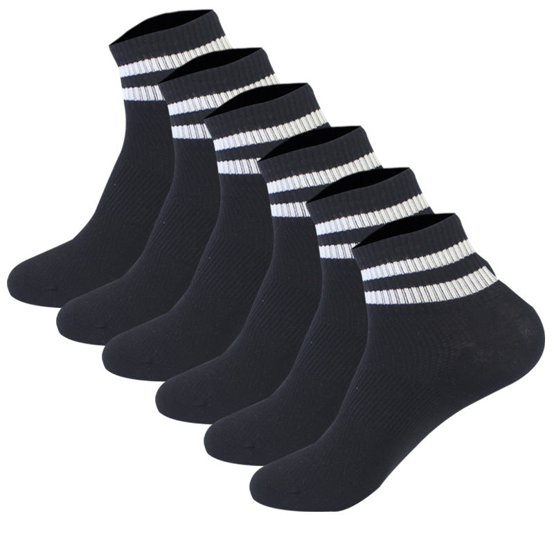 Six-pack of black athletic ankle socks with white stripe detailing on ribbed cuffs, arranged in a row display