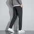 Close-up of pants showing white drawstring with black tips and side panel details