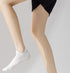 White cotton ankle sock styled with athletic shoe, showcasing breathable comfort design