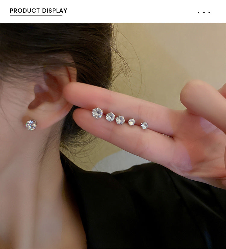 Cubic zirconia earrings showing size progression on ear