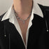Titanium Steel Cuban chain necklace with cross pendants, styled with black blazer and white collar