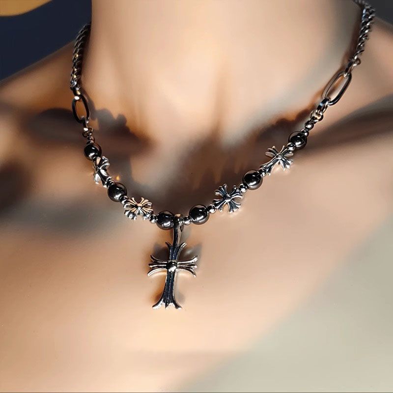 Gothic cross necklace with black beads and silver cross worn on neck