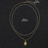 Gold chain necklace with sun charm showing 60cm length