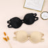 Black and beige strapless bras displayed together with gold-framed sketch and "Mrs." decor