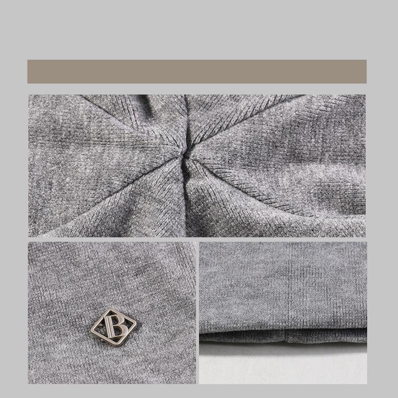 Close-up of gray beanie fabric, showcasing texture and quality construction details