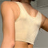 Back view of beige bralette showing quilted pattern detail and racerback design