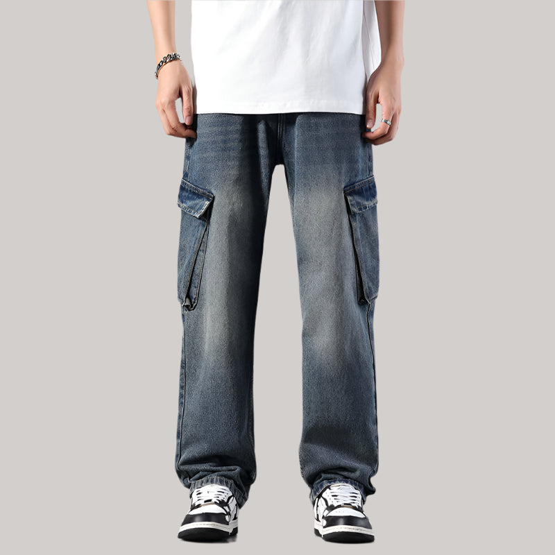 Person wearing faded blue denim cargo jeans with white t-shirt and black/white sneakers
