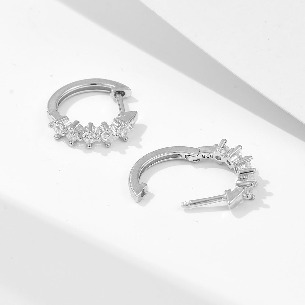 925 sterling silver huggie hoops with five crystals photographed at angle showing clasp mechanism
