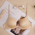 Nude push-up bra with vintage glasses and wedding invitation, lifestyle product photography with soft beige aesthetic styling