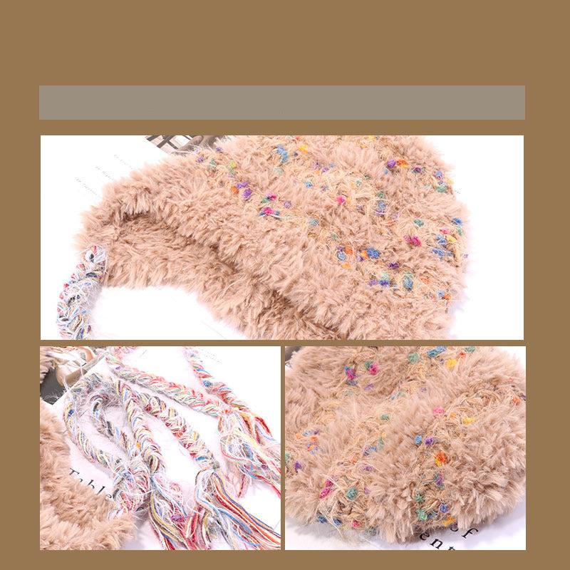 Black fuzzy winter hat with multicolored speckles and long braided multicolor earflaps, showcasing textural details