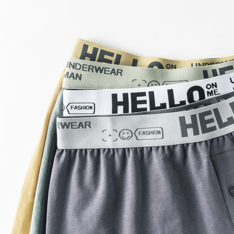 Three stacked boxer shorts showing different colored waistbands, all with 'HELLO' branding and smiley face logo