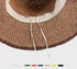 Close-up view of the inner lining of a woven sun hat, showing the adjustable drawstring for a customizable fit.