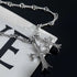 Titanium Steel Gothic cross pendant necklace featuring clear crystal inlay, ornate flared tips, and textured link chain