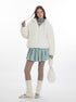 Full-length view of white fluffy jacket ensemble with leg warmers, sparkly flats, and sheer tights
