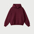 Burgundy oversized hoodie with front pocket on neutral background
