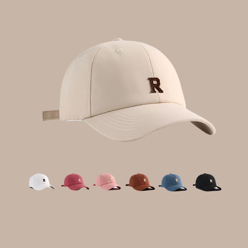Collection of six baseball caps with 'R' logo in beige, pink, red, brown, blue, and black colors, featuring adjustable straps