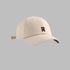 Beige baseball cap with brown 'R' logo embroidery, adjustable strap and structured crown design