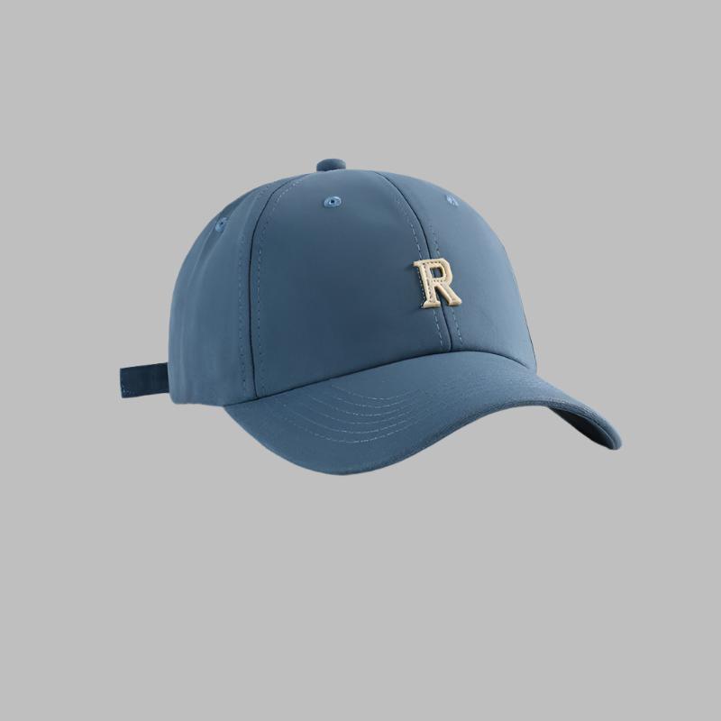 Blue baseball cap with gold 'R' logo embroidery, curved brim and adjustable back closure