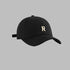 Black baseball cap with gold 'R' logo, curved brim and adjustable back closure desig