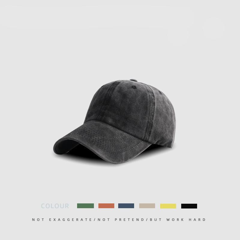 Charcoal gray cotton baseball cap with curved brim and unstructured design