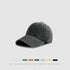 Olive green cotton baseball cap with weathered finish and adjustable fit