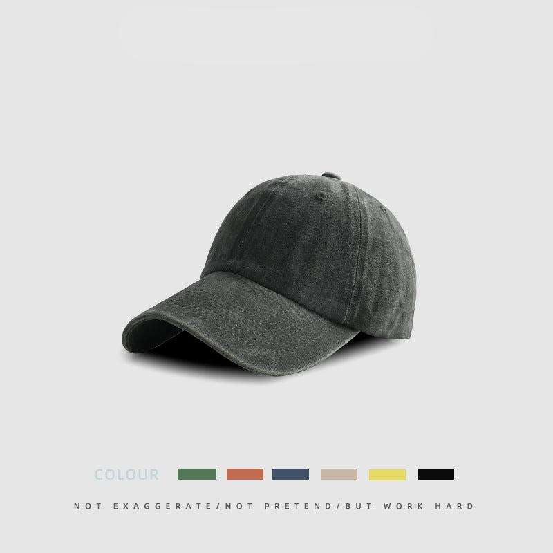 Olive green cotton baseball cap with weathered finish and adjustable fit