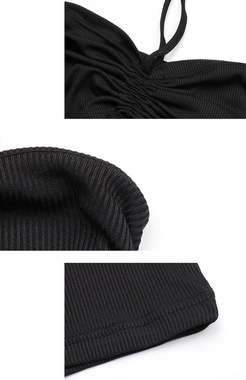 Close-up details of black ribbed fabric showing gathered design, halter strap, and finished hem construction